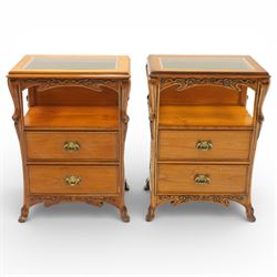 And So To Bed - pair of cherry wood and cane 'Libertine' bedside tables, glass top above a shaped and carved apron, with open recess above two drawers with brass handle, flanked by caned sides, raised on short cabriole supports 