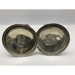 Archibald Knox (1864-1933) for Liberty & Co, pair of Tudric pewter candlesticks, the bud shaped sockets raised upon three angular fin supports and a slightly domed circular base with cast stylised foliate decoration, each stamped beneath Tudric 0223, H30cm