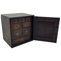 18th century oak spice cupboard, single panelled door enclosing eight drawers of various sizes, reed moulded front edges