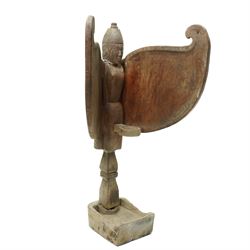 East-Java winged oil lamp, dlupak/ celupak, H64cm and a canoe prow from Sepik river, Papua New Guinea carved as the head of a crocodile L42cm