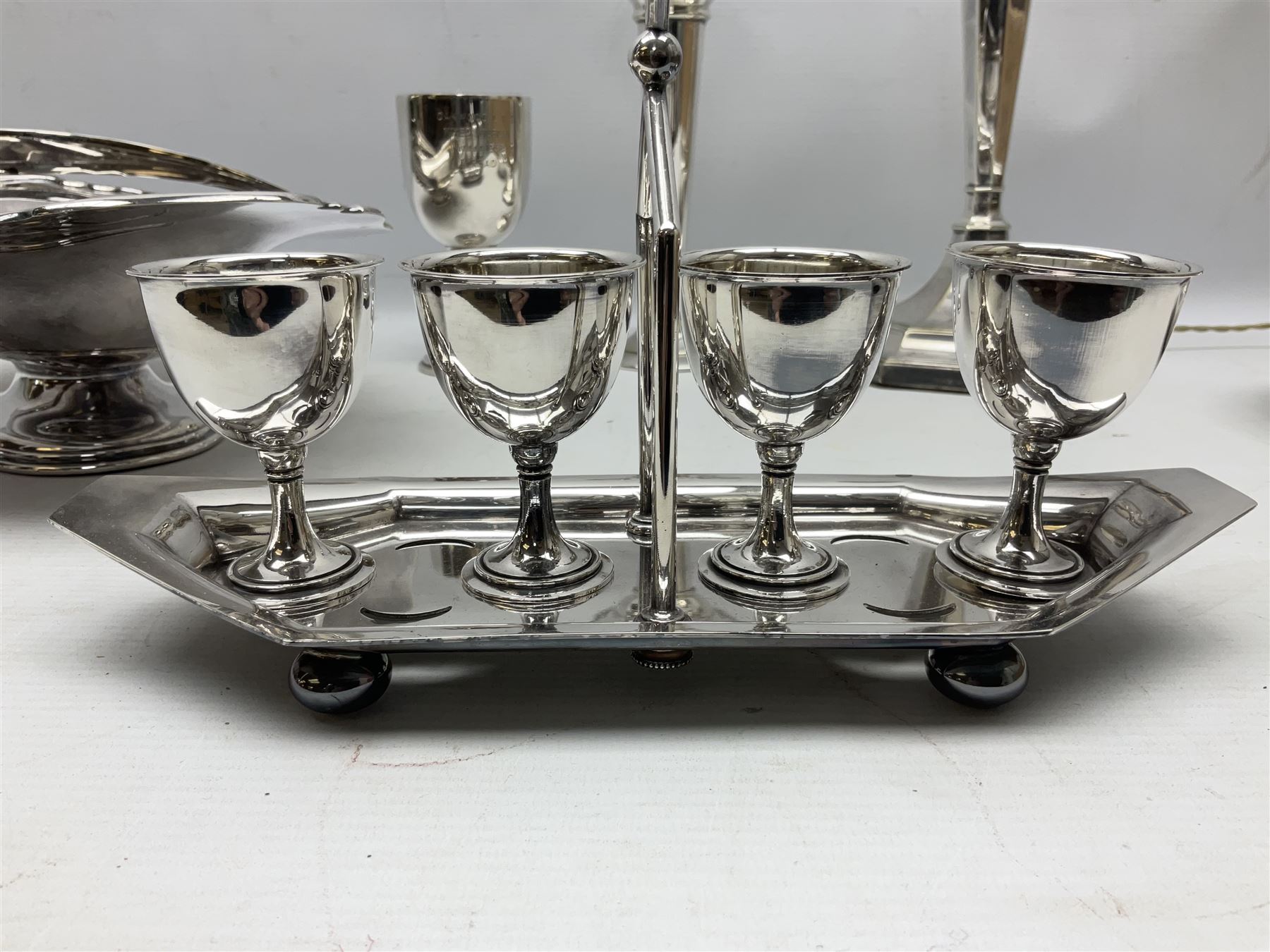 Collection of assorted silver plate, comprising four cup egg cruet, table lamp, bud vase, desk stand etc  