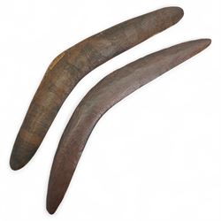 Australian Aboriginal boomerang decorated with eucalyptus leaves, a plain boomerang,  African wood and iron lamellophone and a carved wood tablet with two figures
