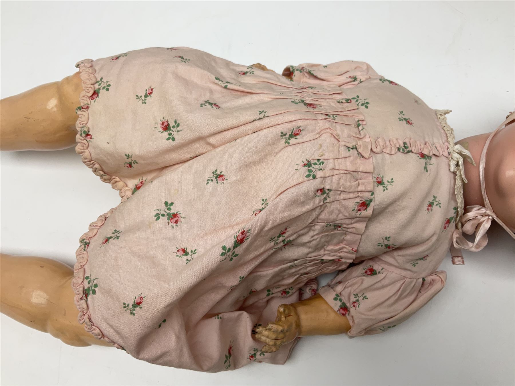 Armand Marseille Koppelsdorf composition head doll with applied hair, sleeping eyes, open mouth with teeth and tongue and composition body with jointed limbs, marked 'AM Koppelsdorf 970 Germany A.7.M' H55cm; Armand Marseille bisque head doll with applied hair, open mouth with teeth and composition body with jointed limbs, marked 'Armand Marseille 390n DRGM 246/1 A3/0M'; Fleur de Genet costume doll; and quantity of 1930s doll's house furniture
