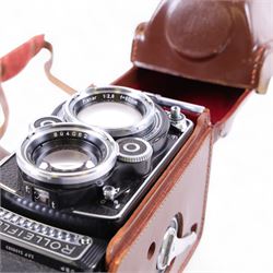 Rolleiflex Franke & Heidecke DBP DBGM 2.8 F TLR camera serial no. 2439093, with a Heidosmat 1:2.8/80 lens serial no. 894062 and a Carl Zeiss Planer 1:2.8 f=80mm lens serial no. 4092068, in leather case with instruction booklet