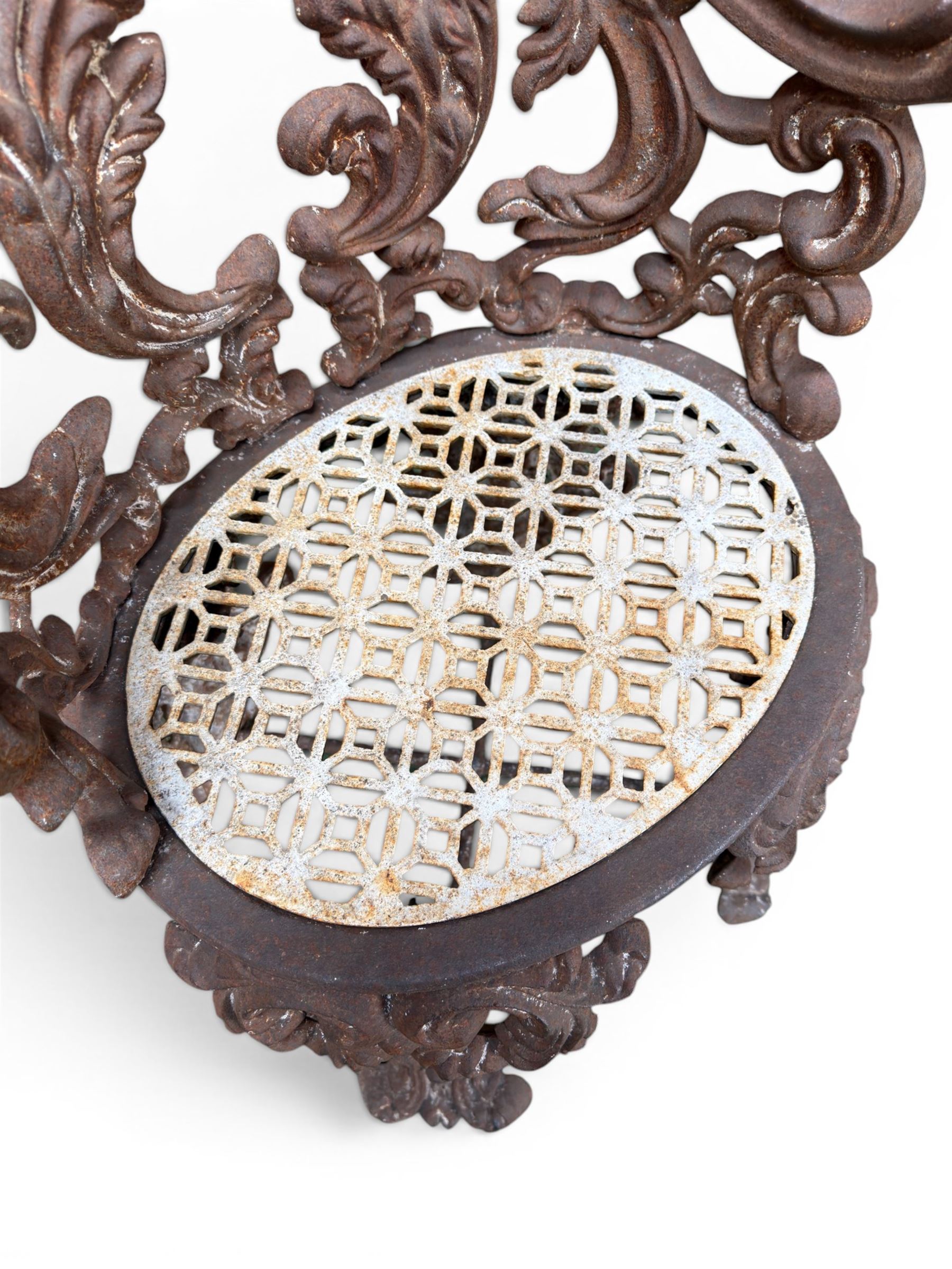 19th century Rococo Revival cast iron garden chair, pierced back comprised of scrolling acanthus leaves, over a pierced geometric white painted drop-in seat, raised on four acanthus and anthemion shaped cabriole supports united by X-frame stretcher