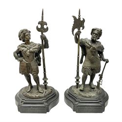 Pair of bronzed figure modelled as a hunter in traditional dress, each holding a pike, H48cm