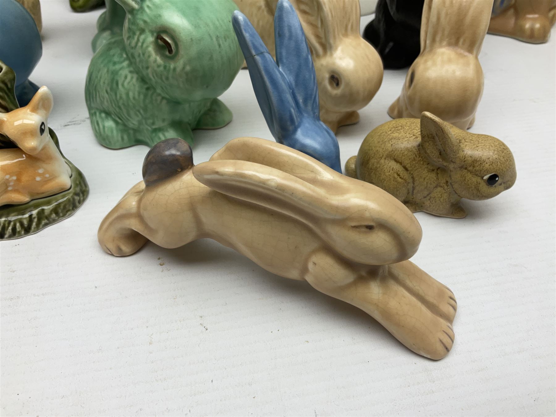 Collection of Sylvac and similar animal figures, including rabbits, hares and dogs, together with Falcon budgie vase, etc 
