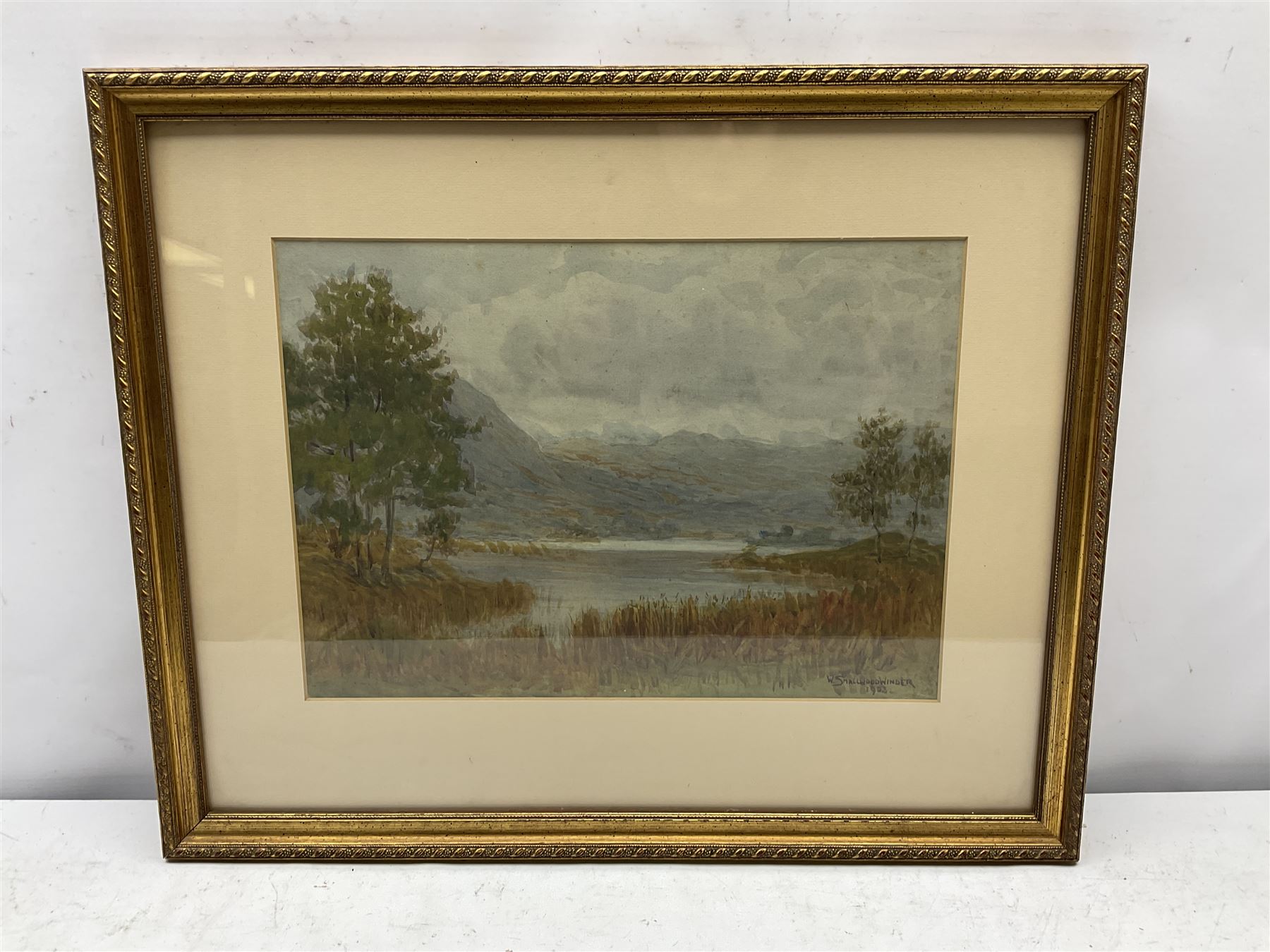 W Smallwood Winder (British 1870-1910): Lake Scene, watercolour signed and dated 1903 together with two further watercolours indistinctly signed max 39cm x 54cm (3)