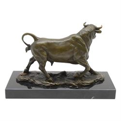 Bronze figure, modelled as a prancing bull, upon a naturalistic base signed Mils and with foundry mark, raised upon a rectangular marble base, overall H14cm
