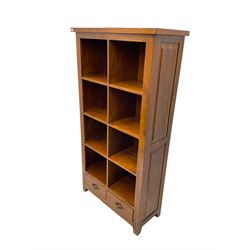 Hardwood open bookcase, fitted with eight open shelves above two drawers, panelled sides on square tapering feet