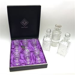 A cased set of six Edinburgh lead crystal drinking glasses, with cut bucket bowls, H14cm, together with a pair of straight sided cut glass decanters with stoppers, and a further decanter with part hobnail cut decoration and mushroom stopper. 