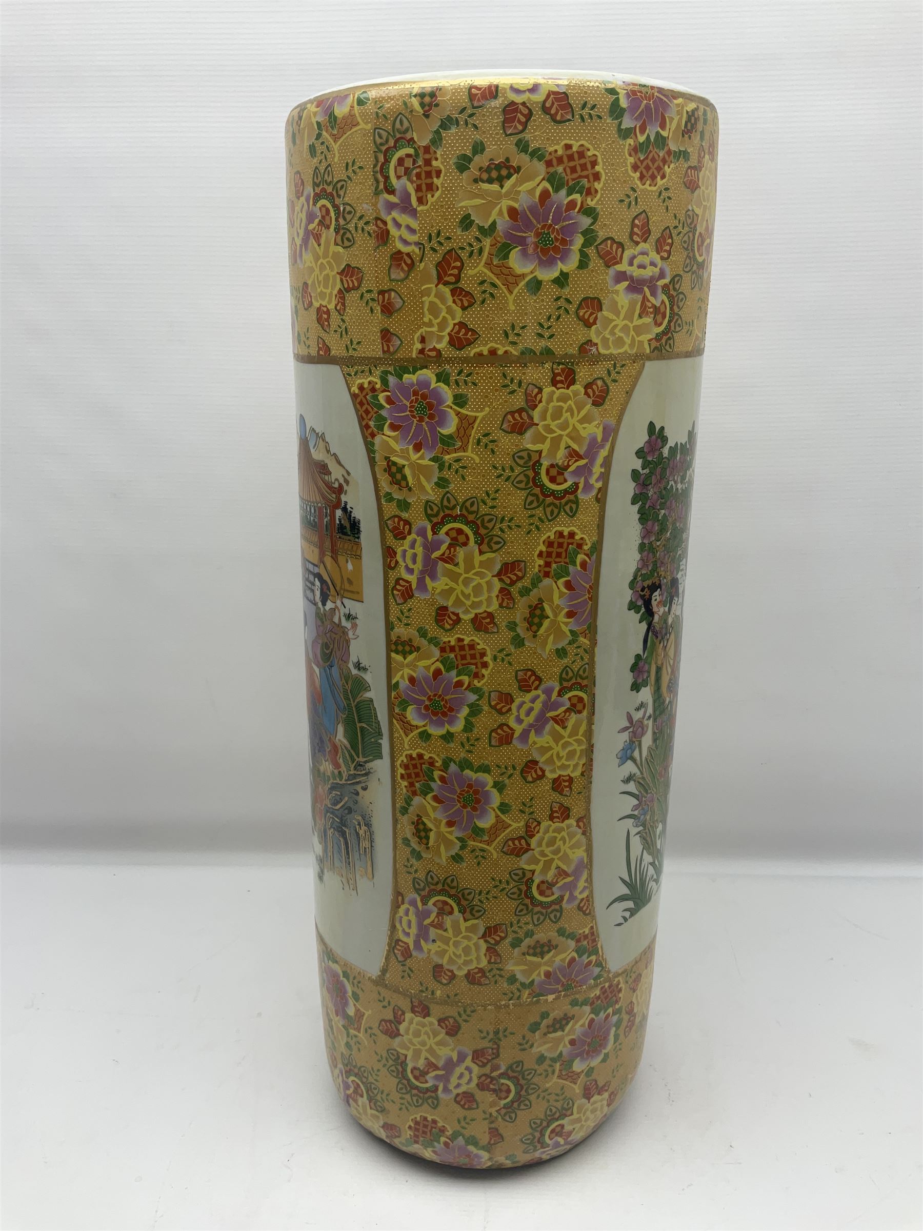 Modern Japanese ceramic umbrella stand, decorated with a figural panel on a yellow floral ground, H60cm