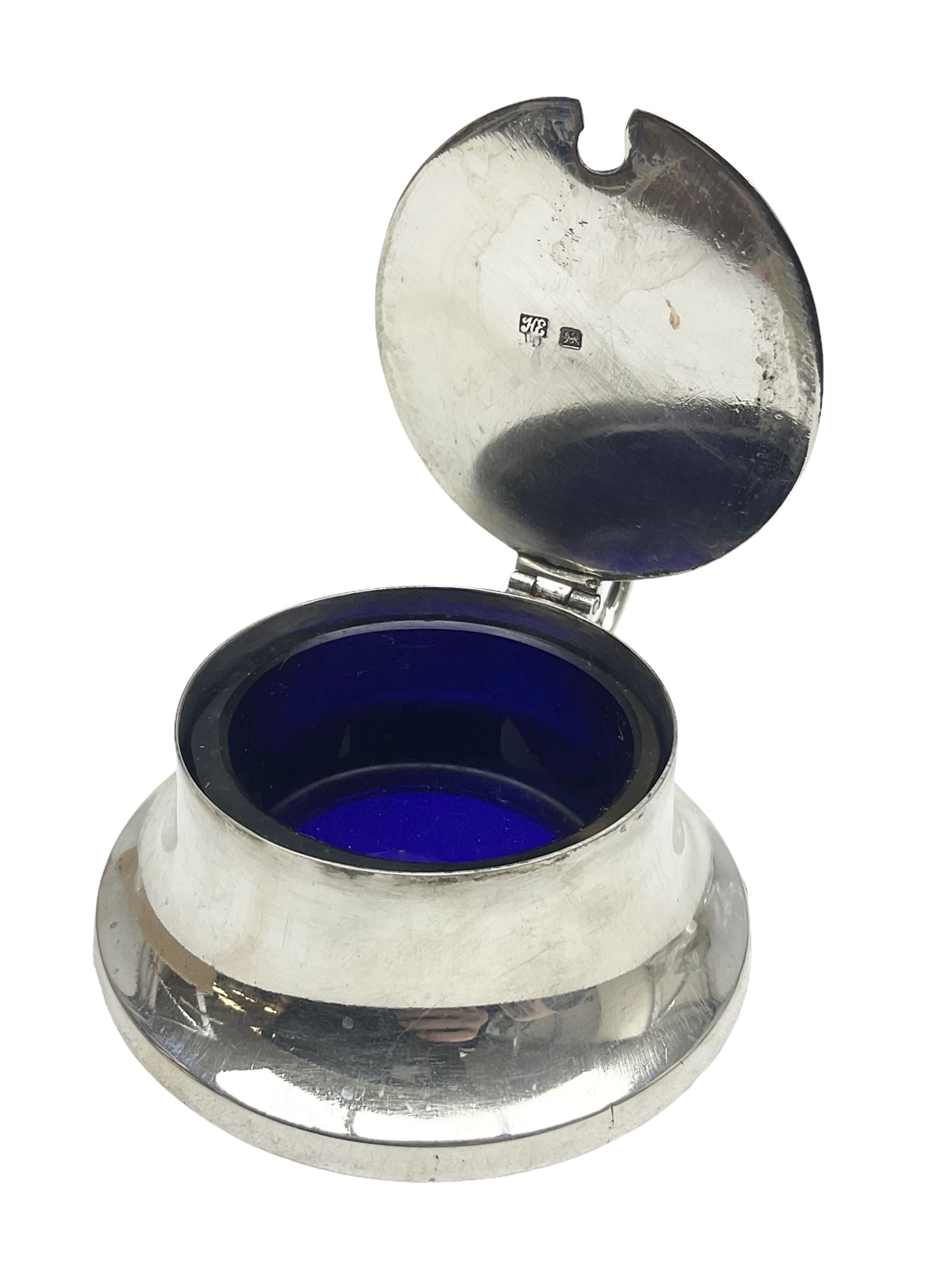 Early 20th century silver mustard pot and cover, with blue glass liner, hallmarked Hawksworth, Eyre & Co Ltd, Sheffield 1911, approximate silver weight 59.4 grams