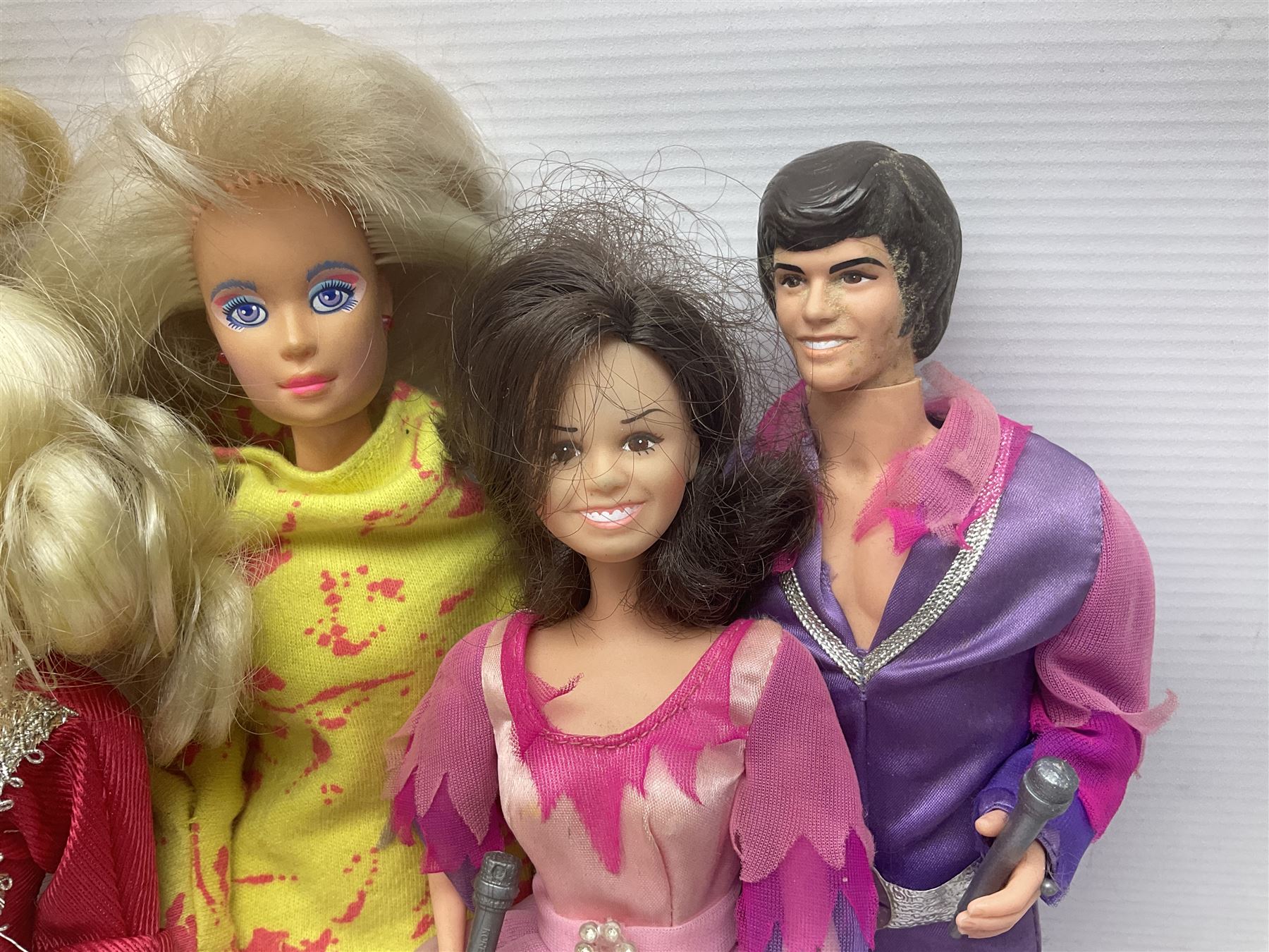 Pelham Puppet - Tyrolean Girl in yellow box; three 'A' Team action figures; clockwork plastic Mickey Mouse figure; and seven various fashion dolls (12)