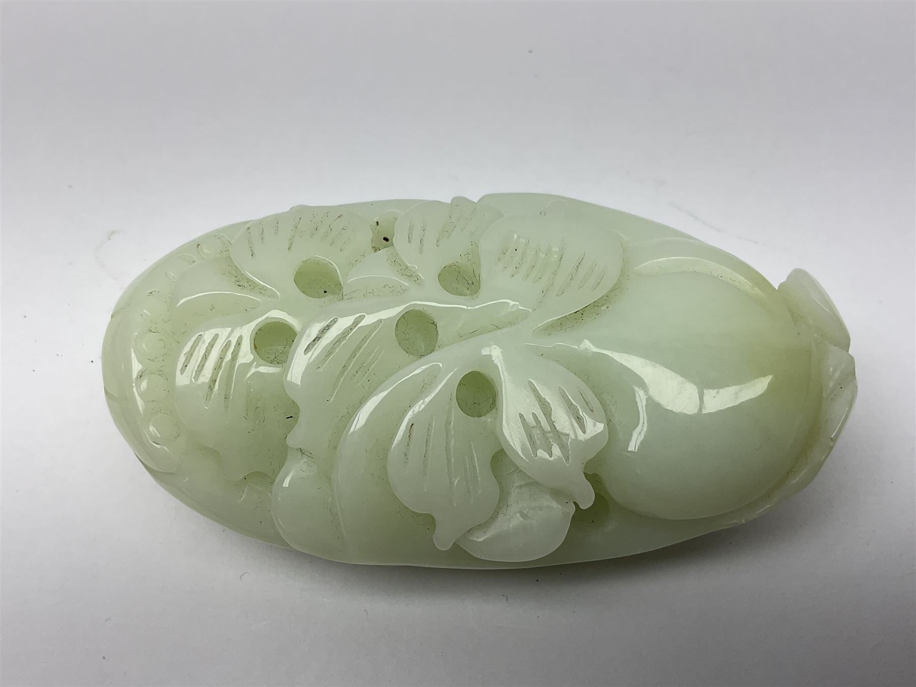 Chinese hardstone carving of a fish amongst coral, with platted rope handle, together with other hardstone and soft stone carvings  