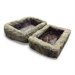 Two 19th century stone troughs, with mill stone, flagon and metal milk churn 