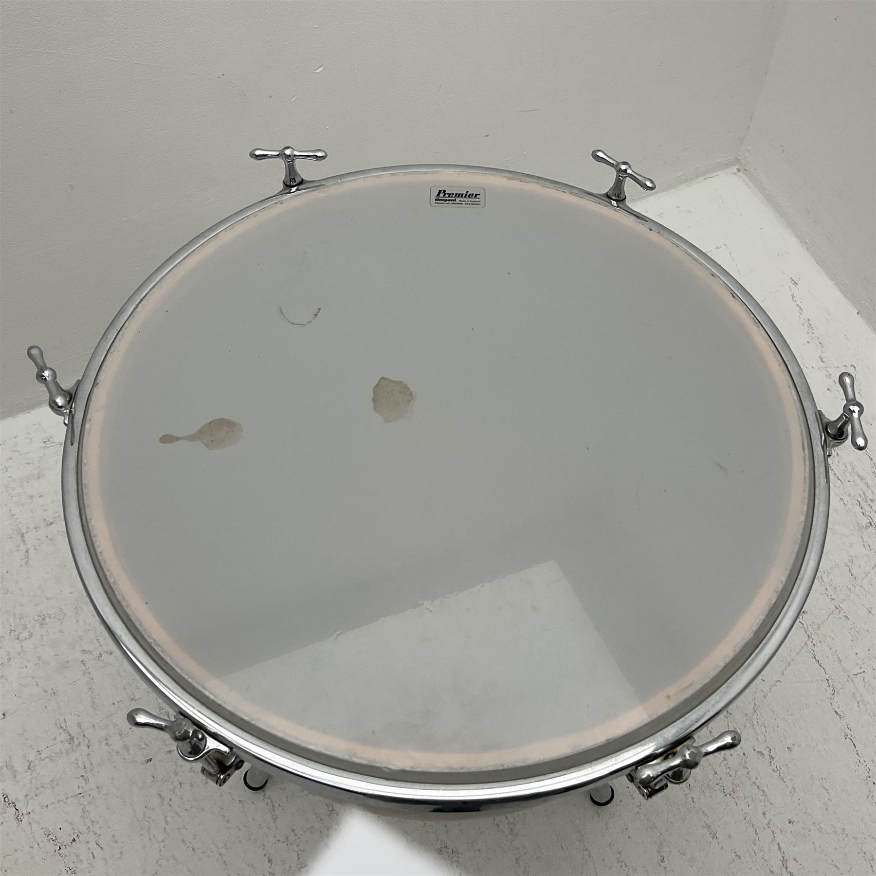 Timpani drum with coppered finish to the bowl, marked 'BS 3499' underneath, three adjustable tubular legs and Premier head D67cm
