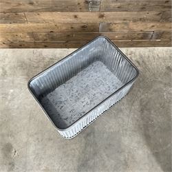 Set of three pressed metal planters in different sizes