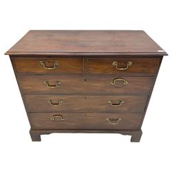 George III mahogany chest fitted with two short over three long drawers, raised on bracket supports
