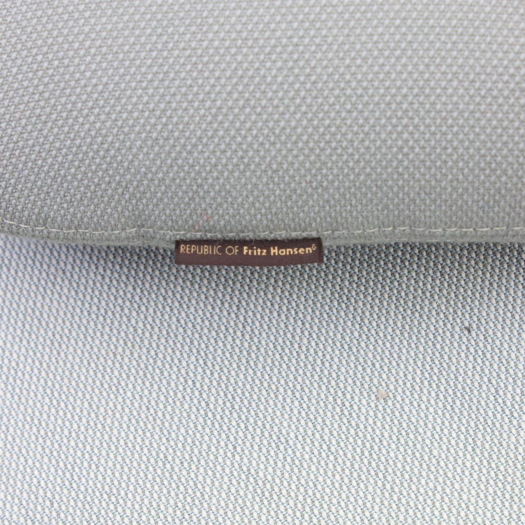 Fritz Hansen - 'Favn' sofa, designed by Jaime Hayon (1974-), upholstered in light grey fabric, the organic curved back and integrated arms enclosing loose seat and back cushions, raised on slender cylindrical metal supports