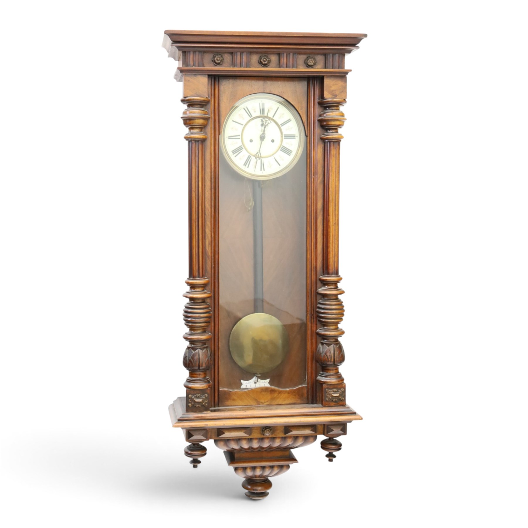 19th century mahogany Vienna Regulator wall clock, carved mahogany framed with turned and half-canted pilasters, over a lobed terminal