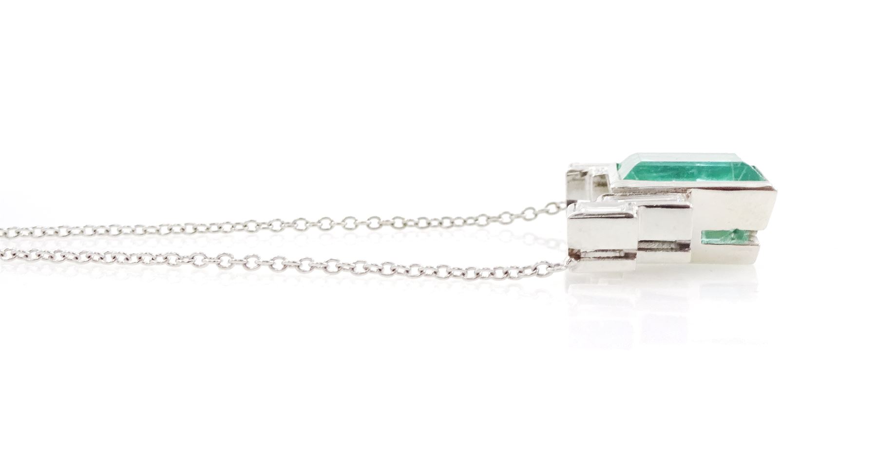 Platinum Siberian emerald and diamond necklace, single rectangular cut emerald of approx 5.70 carat, with two rectangular cut diamonds set either side, to a trace link chain necklace, hallmarked, total diamond weight approx 0.70 carat, the GCS certificate
