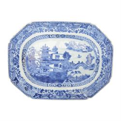 19th century Cantonese plate of octagonal form decorated to the centre with a garden of flowering peonies, together with two other 19th century plates and two serving platters each depicting temples in landscapes, octagonal plate W31cm  