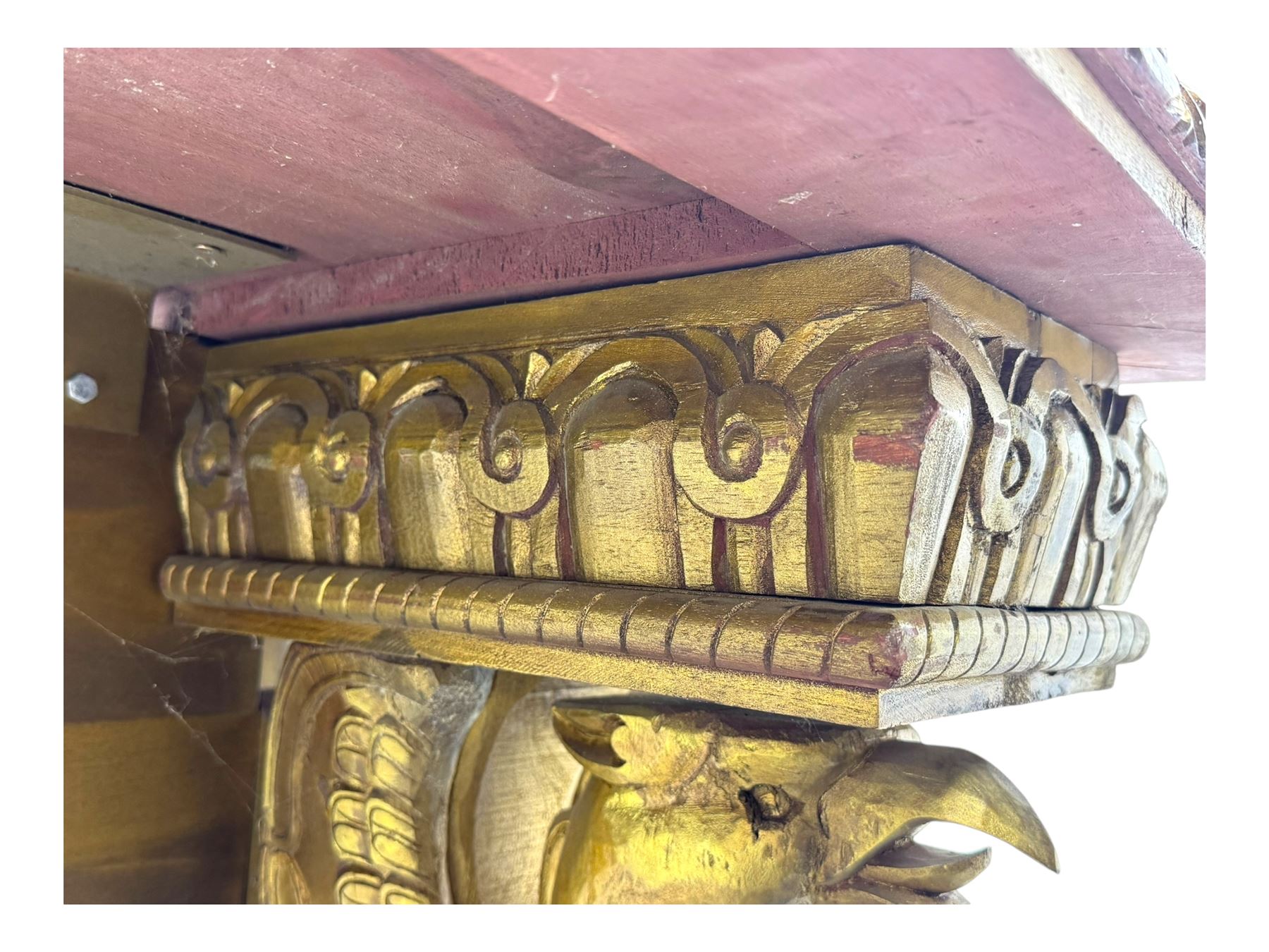 19th century Renaissance Revival carved and giltwood centre table, the rectangular top with gadrooned edge and carved frieze of repeating arched motifs with stylised scrolls, supported by a pair of carved winged griffin supports restrained by a central chained figure, on stepped rectangular bases united by carved stretcher