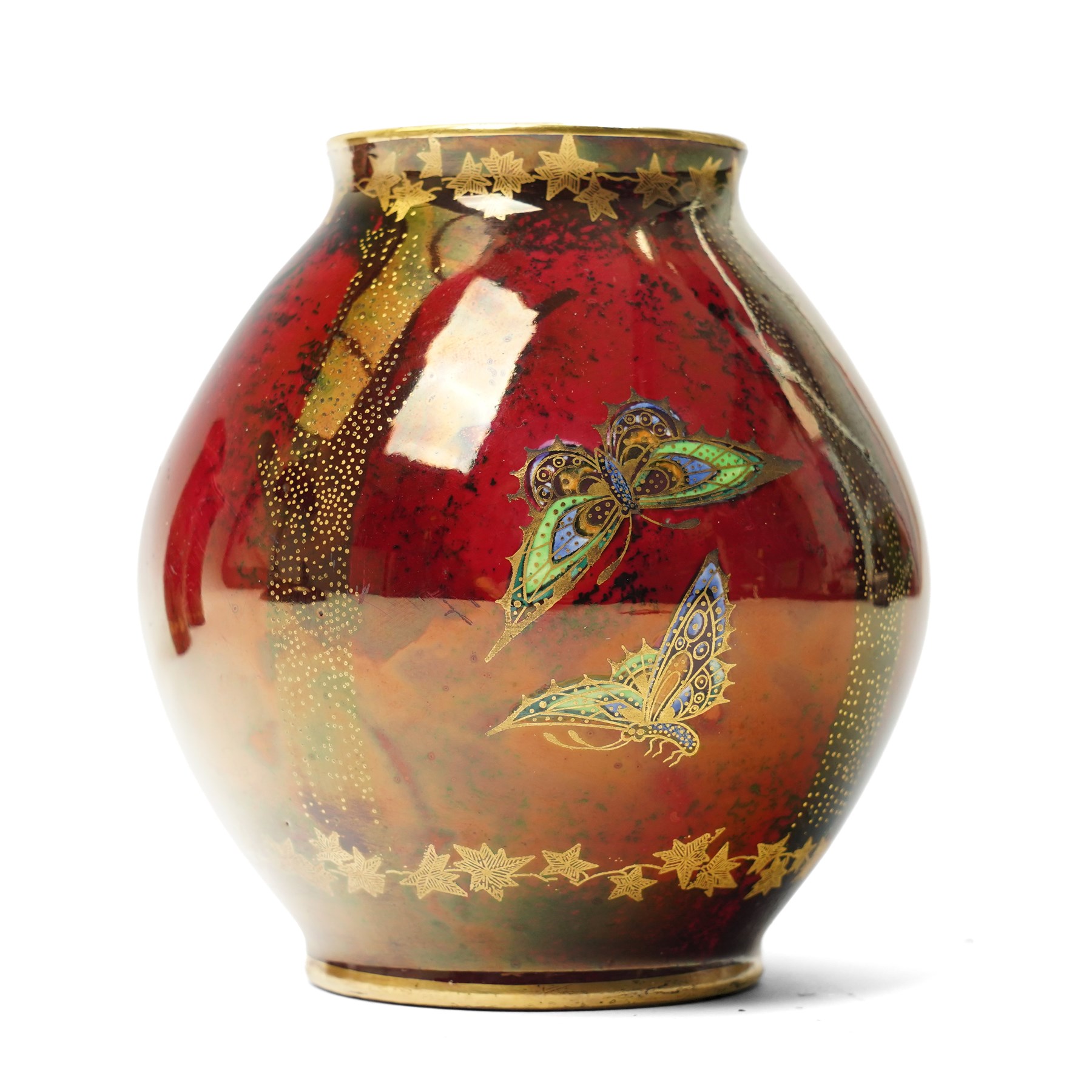 Four pieces of Fielding's Devon Lustrine, comprising a small pair of sleeve vases, H15cm; a bowl and vase, each decorated with butterflies and leaves in gilt on a red ground, printed marks beneath (4)