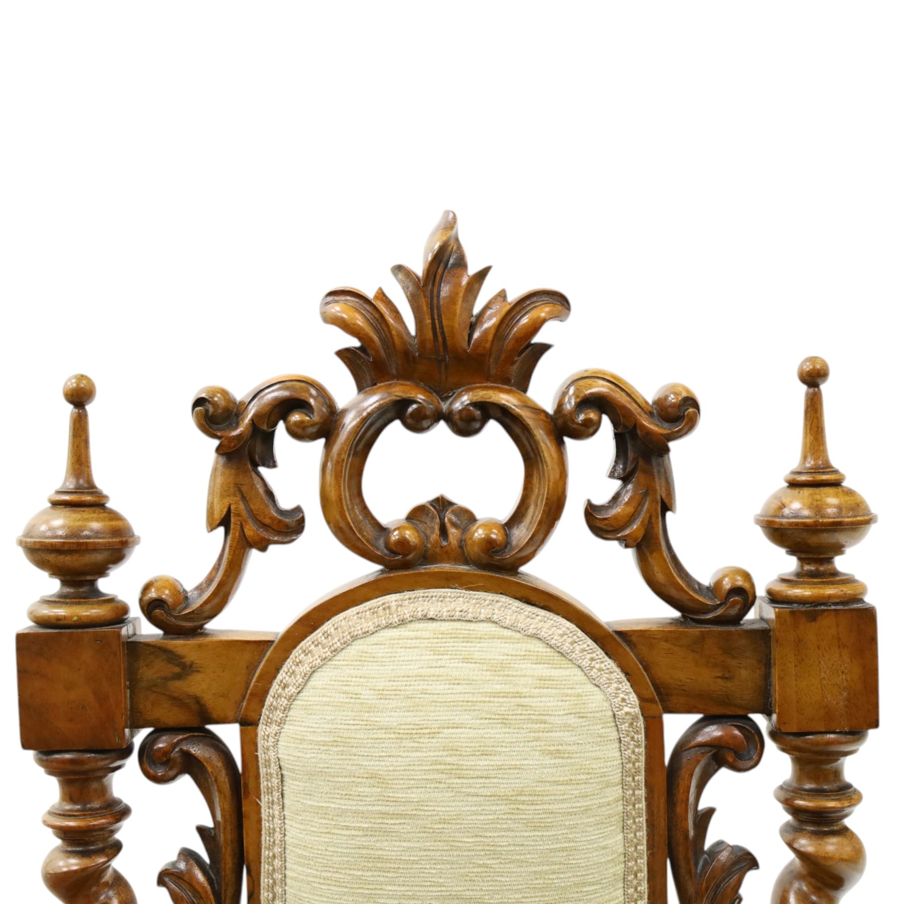 Victorian carved walnut side chair, the ornate high back with pierced and carved scrolled cartouche cresting rail, the back panel and sprung seat upholstered in sage green fabric, flanked by scrolling acanthus leaves and spiral turned pilasters, raised on scroll carved cabriole legs with ceramic castors