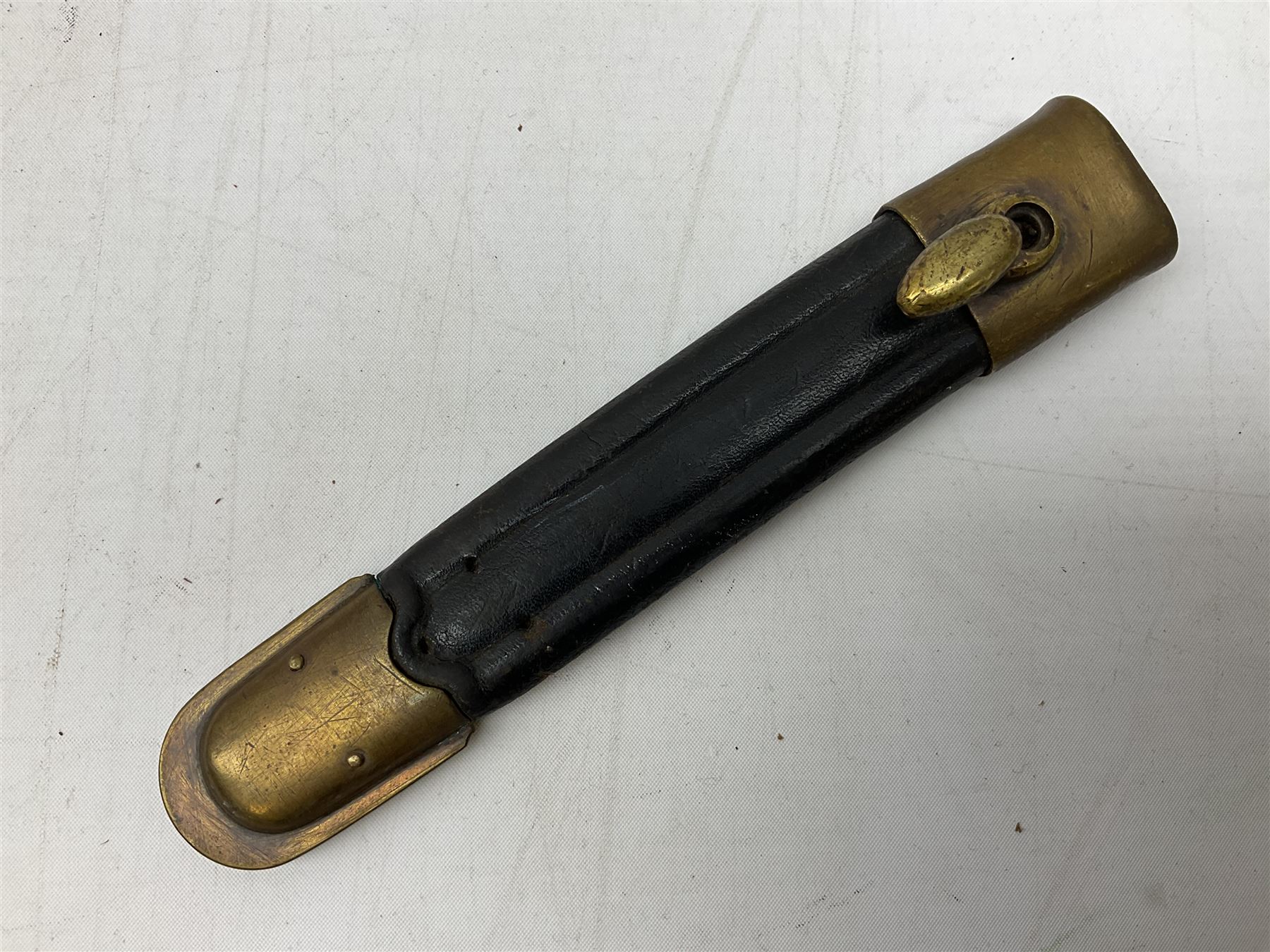 Italian Model 1891 Carcano knife bayonet with 30cm fullered steel blade, the cross-piece stamped VL1110; in steel scabbard with webbing frog L43cm overall; and another Italian fighting knife/bayonet in brass bound leather scabbard (2)