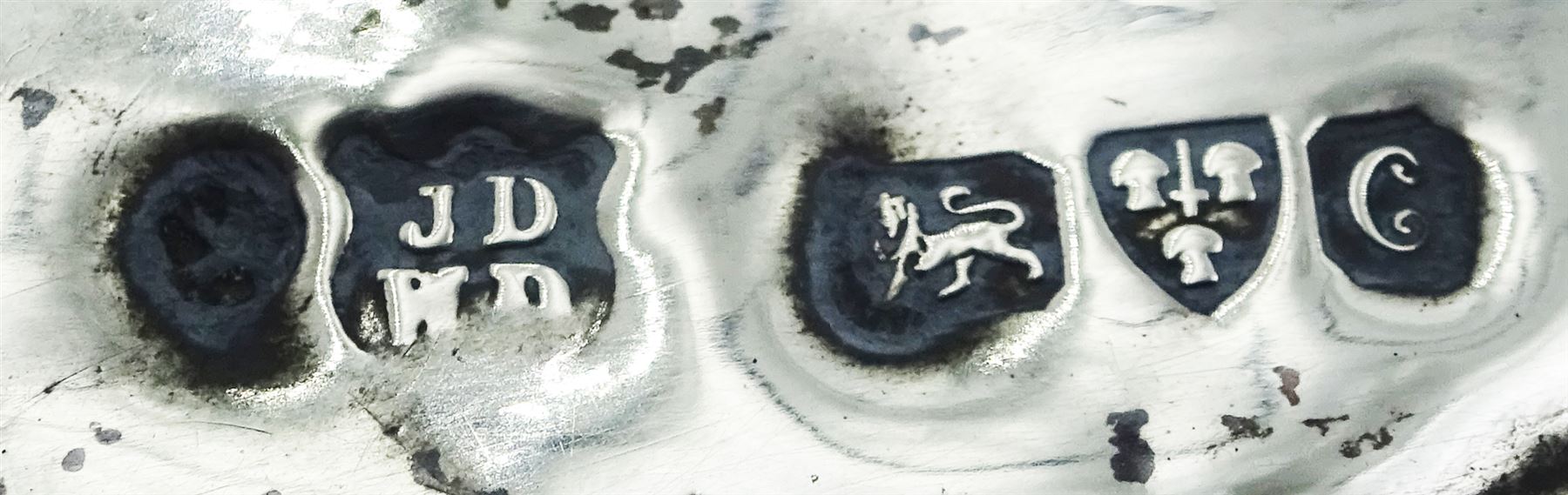 Edwardian silver mounted handheld mirror, decorated in relief with a