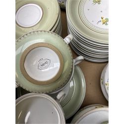 Quantity of Denby Verona pattern tea and dinner wares, decorated with floral sprays and within green borders, to include lidded twin handled bowls, teacups and saucers, dinner plates etc in two boxes