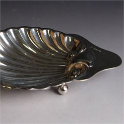 Edwardian silver clam shell butter dish, upon three bun feet, hallmarked James Deakin & Sons, Sheffield 1910