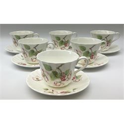 Wedgwood Apple Blossom pattern dinner and tea wares, comprising six dinner plates, six side plates, six bowls, nine smaller bowls, six tea cups and six saucers, milk jug and open sucrier. 