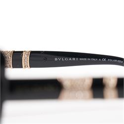 Bulgari - pair of oversized cat-eye sunglasses, with gradient tinted lenses in a black frame, the temples and arms with gold-tone hardware inset with pave-jewelled hinge detail, with original cloth pouch, hard leather case and box