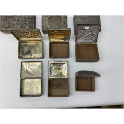 Collection of 20th Century and later Japanese metal cigarette boxes, to include examples highly decorated in relief, decorated with Chrysanthemum flowerheads, dragons, cranes, etc, together with other Japanese boxes (17)
