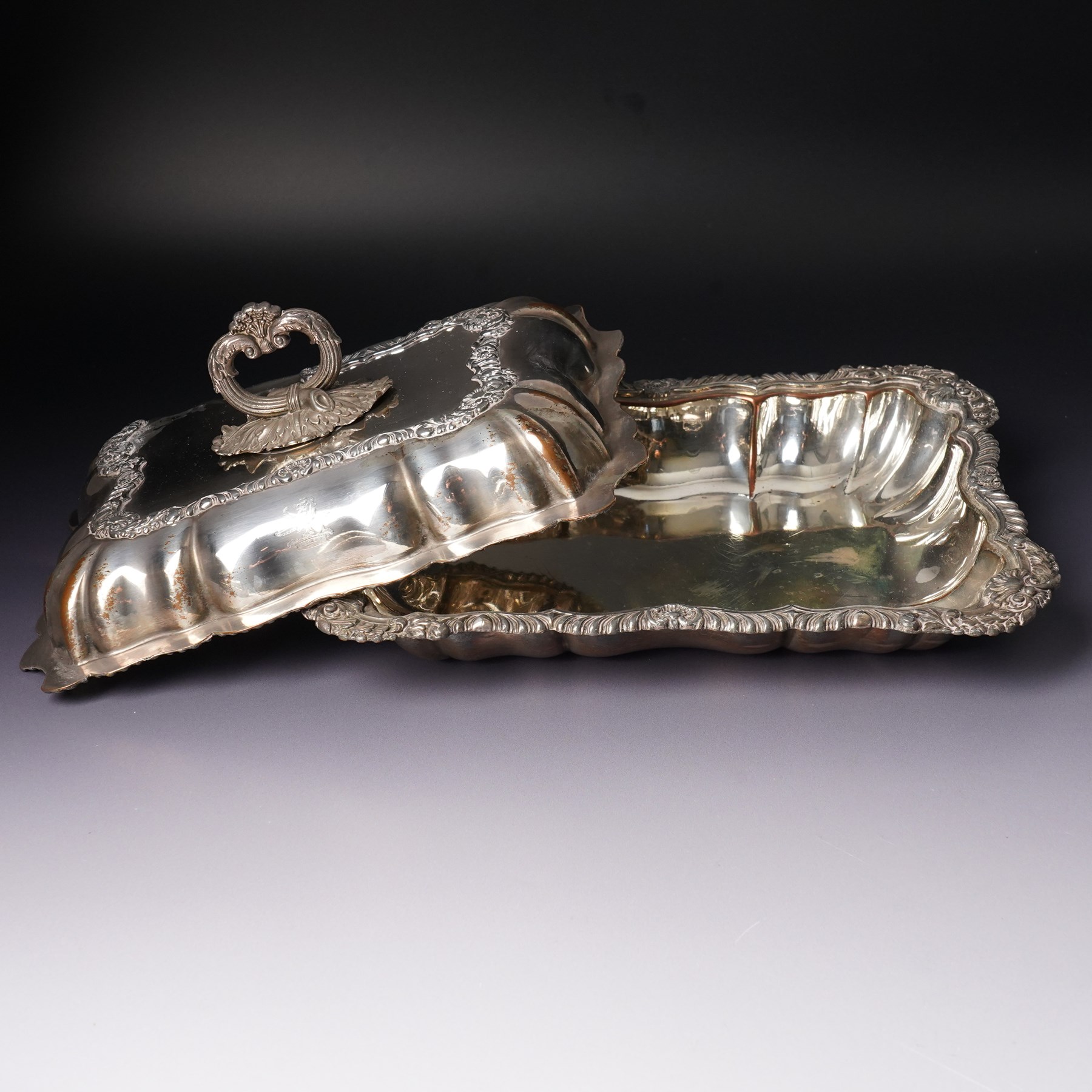 Pair 19th century silver plated entree dishes and covers with gadrooned and shell moulded borders and loop handles engraved with a crest and another similar
