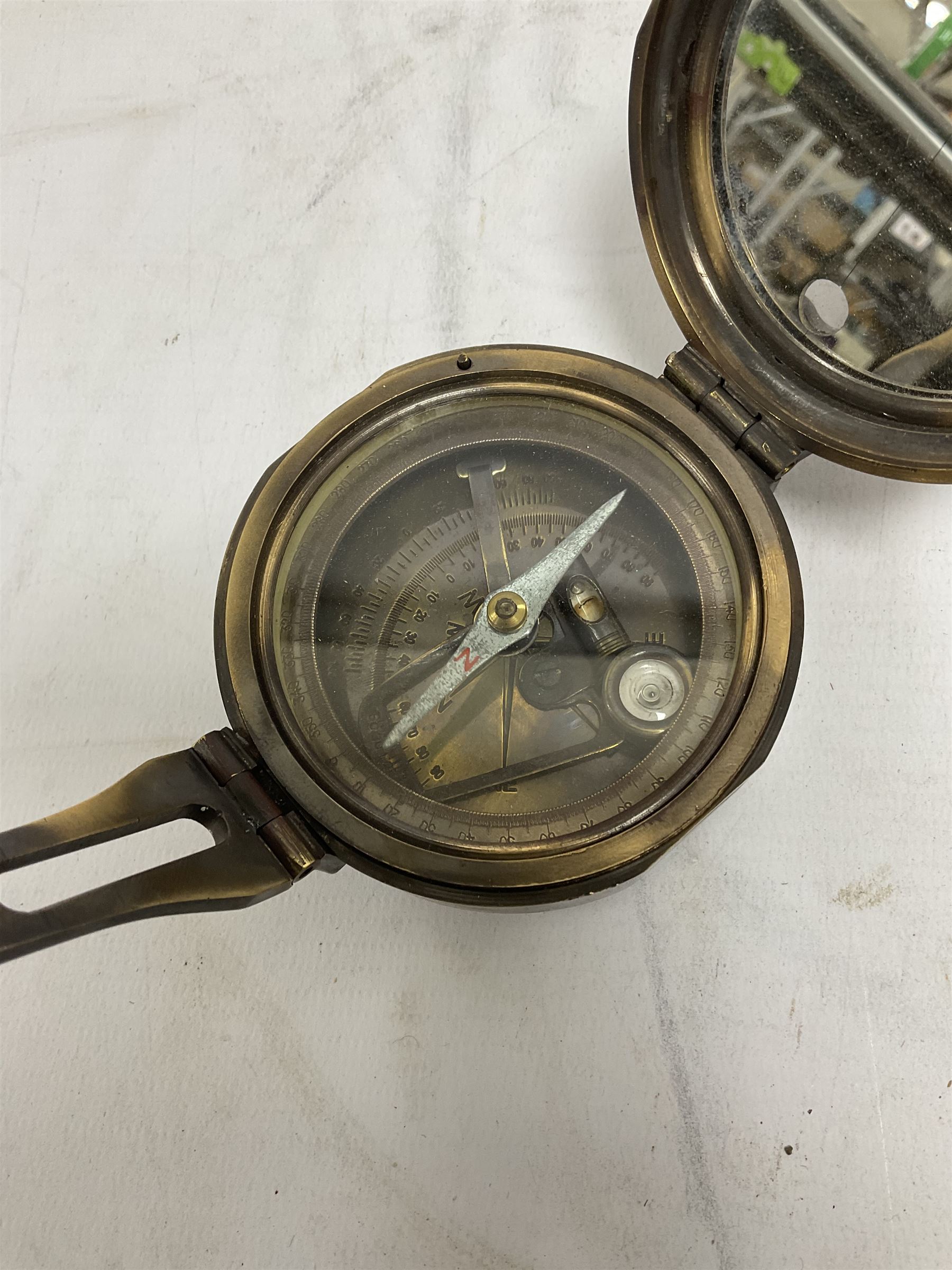 Brass military compass marked Brinton Compass, Thos Evans and Son London, L9cm