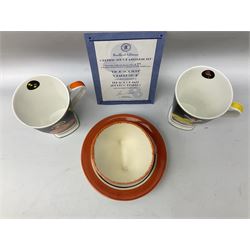 Two limited edition Bradford Exhange Clarice Cliff Age of Jazz beakers, no 289/4,999, with certificate, in box, together with a Moorland Art Deco Clarice Cliff style Huntley Cottage pattern teacup and saucer 
