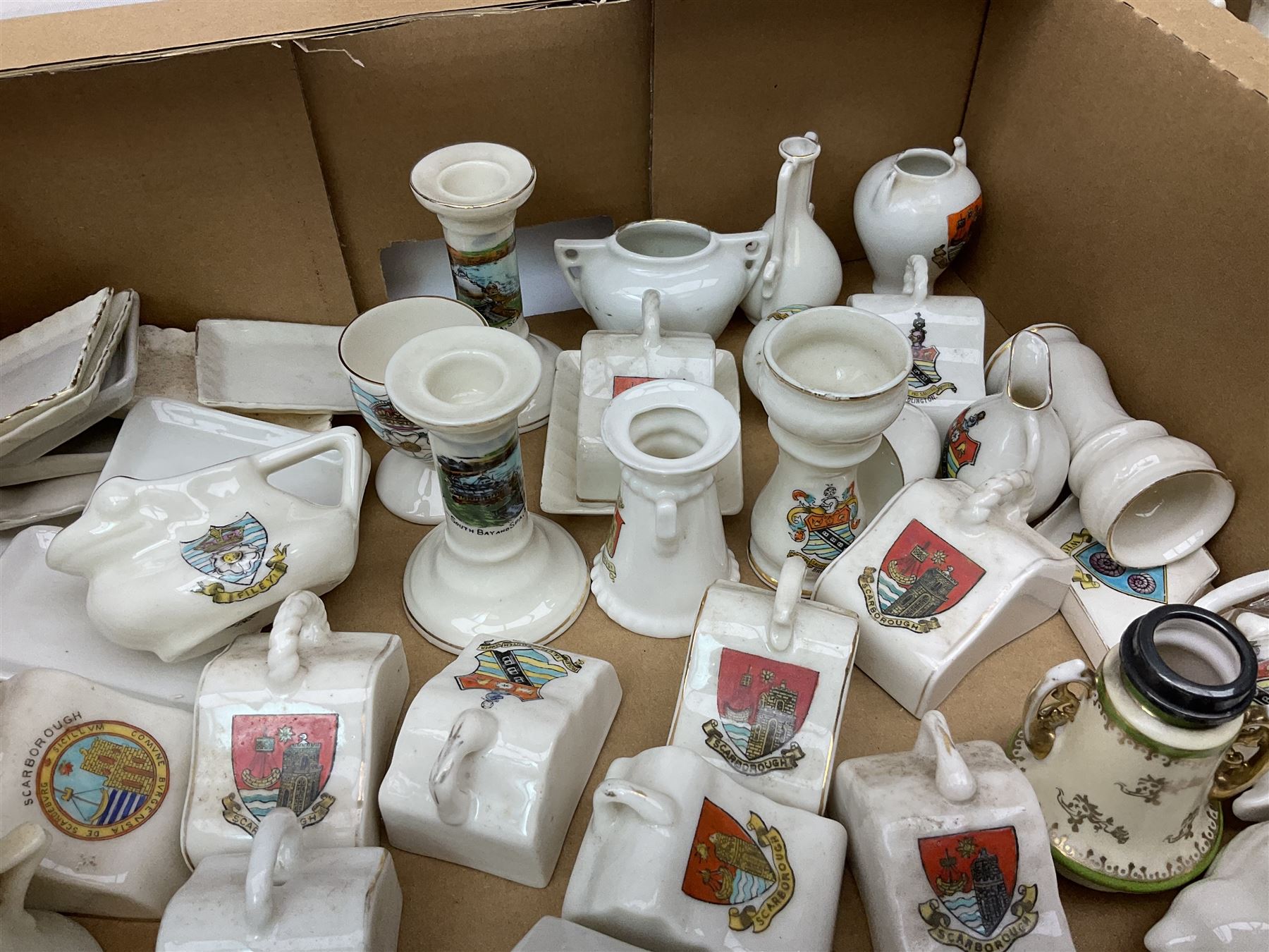 Collection of crested ware, to include Scarborough Willow Art coal truck, Whitby Willow Art Burns and Highland Mary figure group, Carlton China beer drinker 'Tak Hod an Sup Lad', and 'Here's ta me an'ma wife's usban', lighthouse, boat, Kingsway Art China Sir Walter Scott's Chair, butter dishes, candlestick, pianos etc