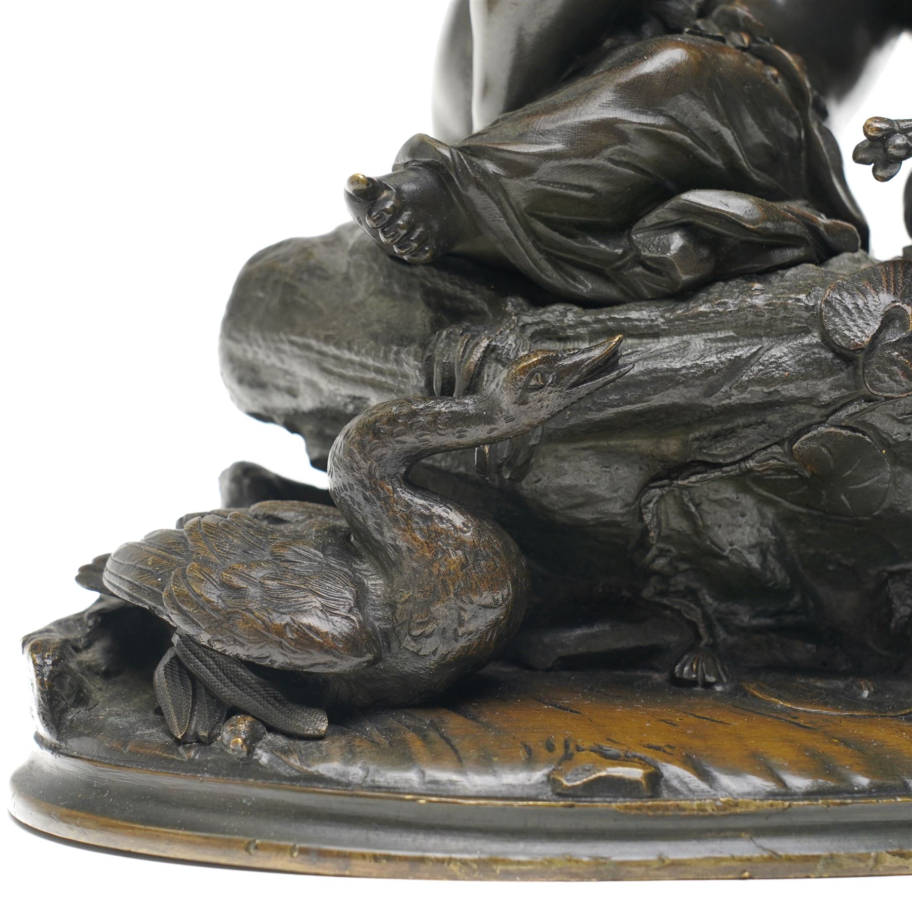 French School (20th Century); bronze depicting putti feeding a swan from a rock, unsigned, H26cm 