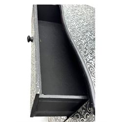 Contemporary black lacquered metal-clad chest, embossed with silver floral scrollwork, shaped rectangular top over three drawers, on cabriole supports (W89cm, D40cm, H79cm); matching two drawer chest (W68cm, D35cm, H67cm)