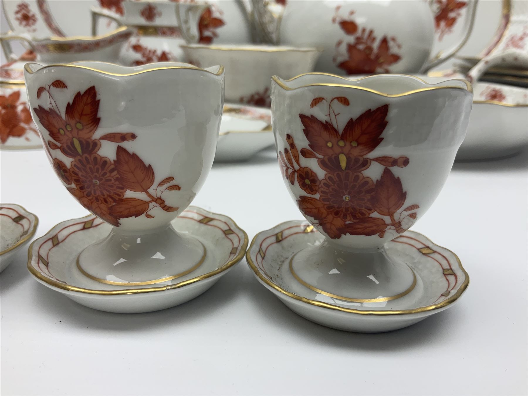 Herend Chinese Bouquet Rose pattern tea service comprising teapot, coffee pot, open sucrier, six cups and saucers, six tea plates, cream jug and stand, milk jug, two teabag holders, preserve pot, two leaf shaped dishes, four egg cups, salt & pepper pots, pair side plates and another plate