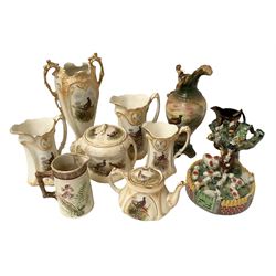 Staffordshire style figure group spill vase, modelled as a shepherd with tree surrounded by sheep and other animals, a copper lustre jug, and other ceramics decorated with pheasants etc