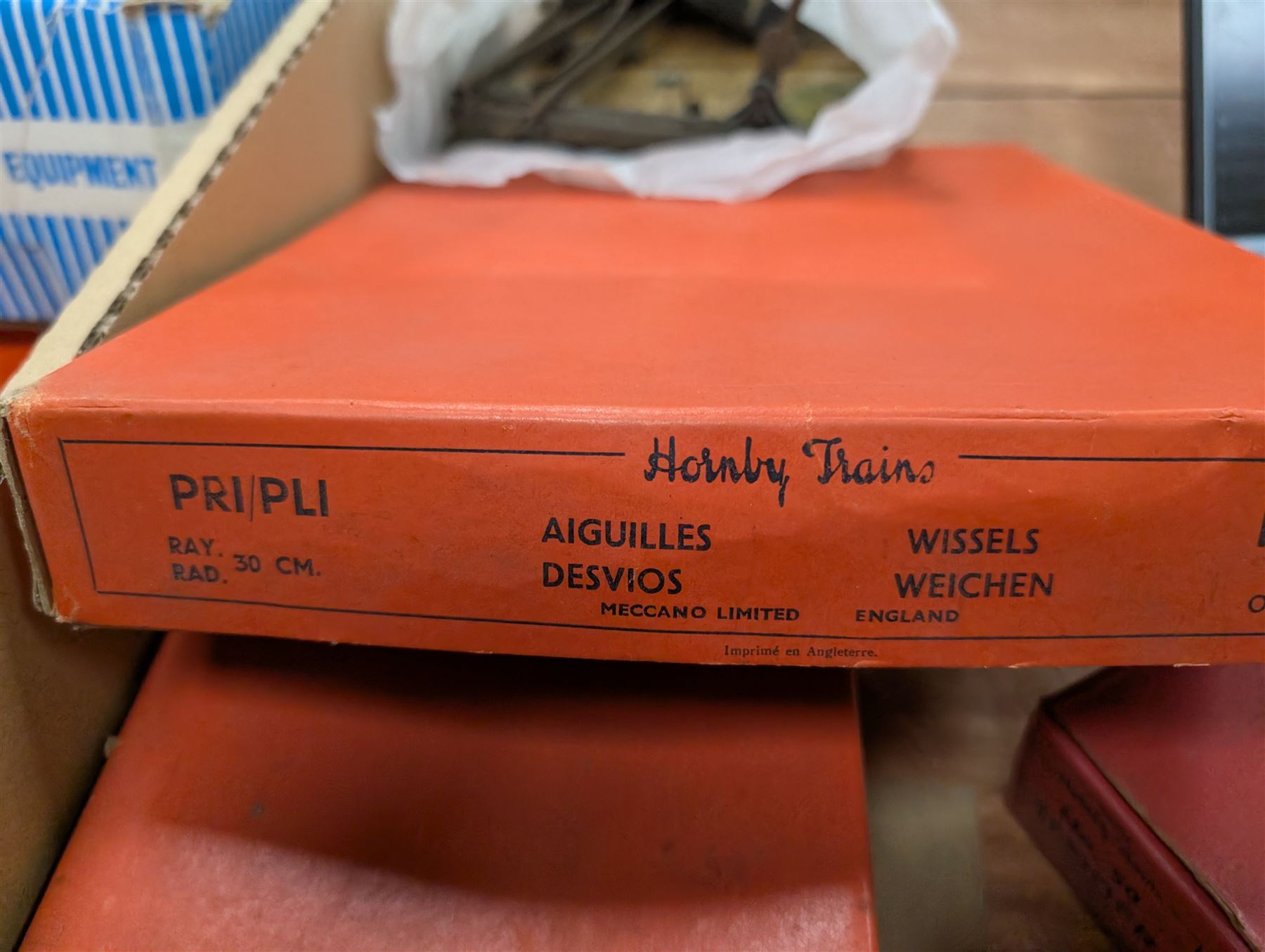 Hornby 'O' gauge 42380 No.2 Turntable, 43063 Points and 42320 No. 1 Level Crossing, all boxed, together with two tin plate passenger coaches, Hornby 'O' gauge LMS tender, three plastic 'O' gauge wagons, Hornby mechanisms, HM Duette Transformer Controller and other accessories