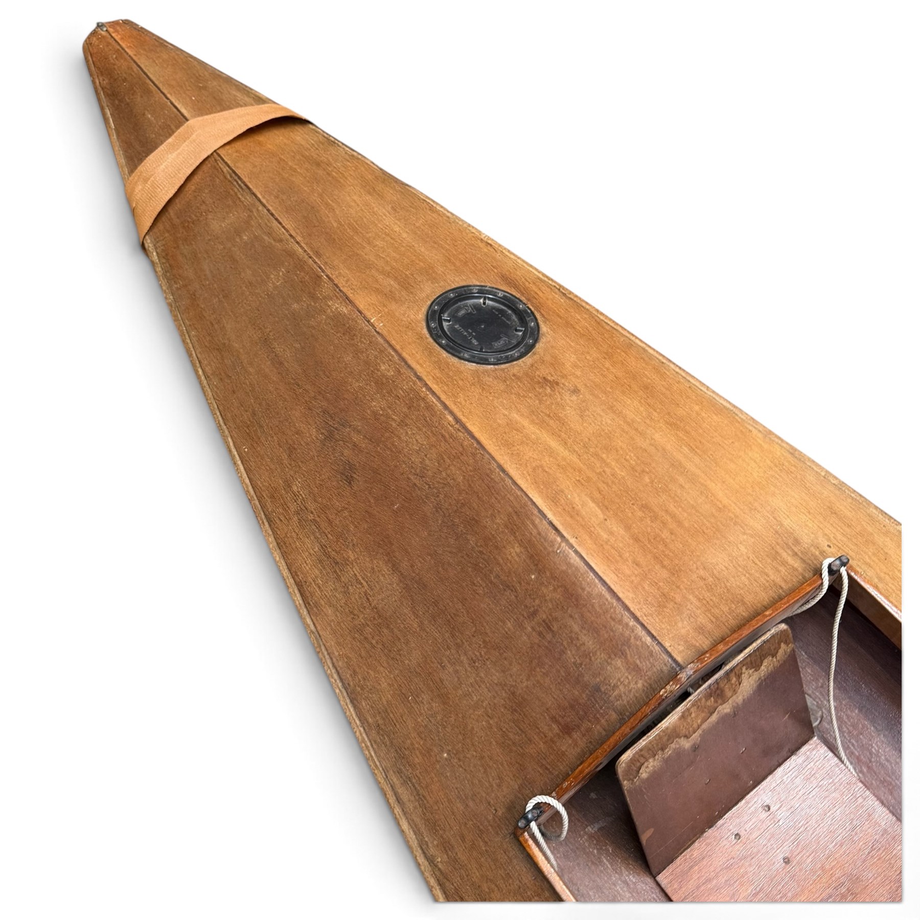 Mid-20th century varnished marine plywood two-person touring kayak, the decked hull with pointed bow and stern, two circular Holt-Allen access hatches and central open cockpit fitted with seats