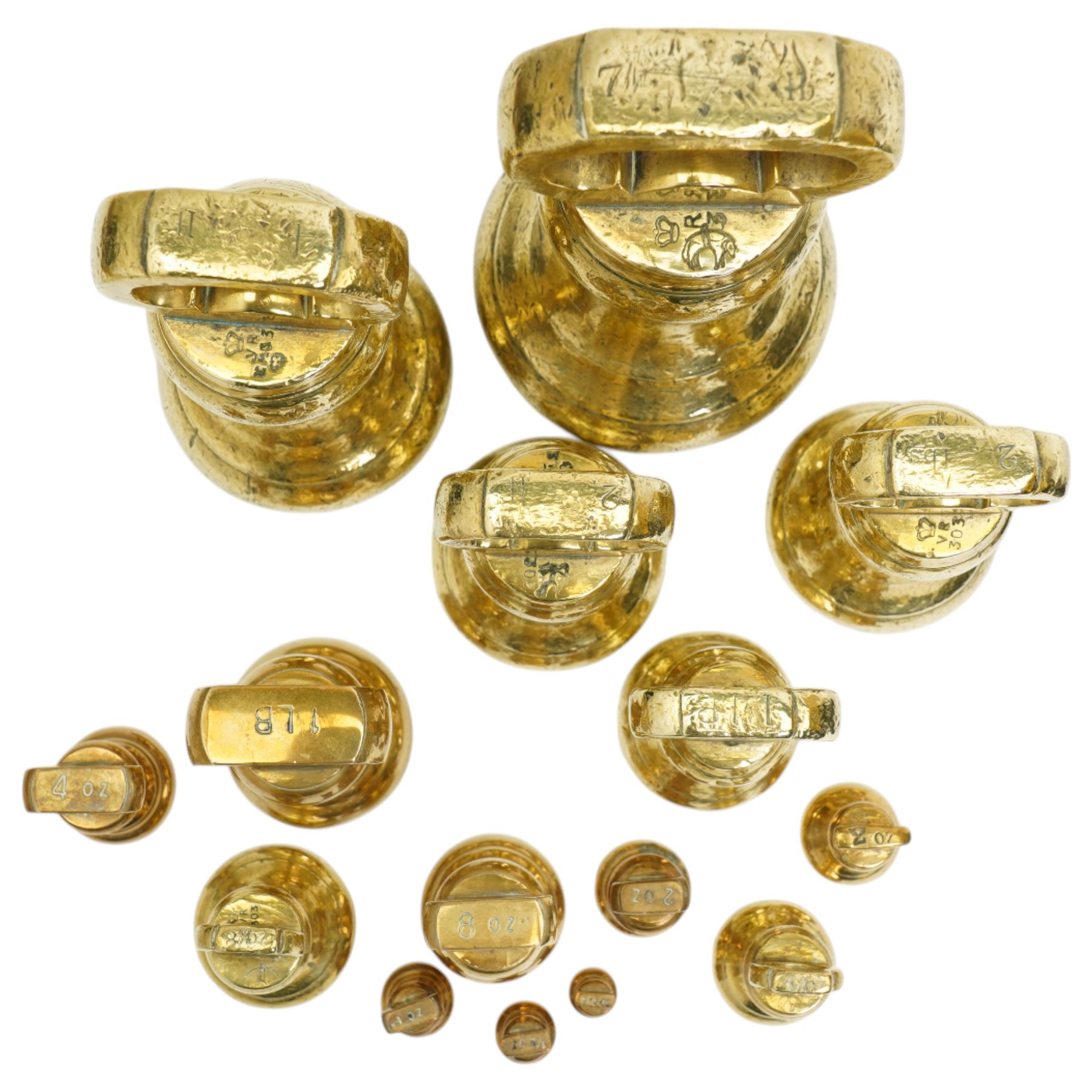 Group of fifteen brass bell weights 1/4oz-7ibs mostly Victorian, some marked with a sheep in a sling, possibly the mark for Holmfirth and a set of Libra scales with a set of graduated brass flat weights