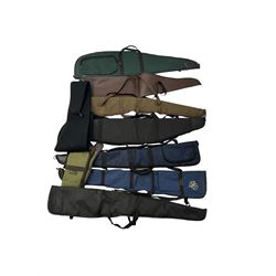 Collection of gun slips, including BSA guns and napier examples and leather 12-bore cartridge belt 