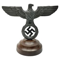WW2 German cast white metal desk ornament/paperweight as the eagle insignia on later turned mahogany plinth H22cm